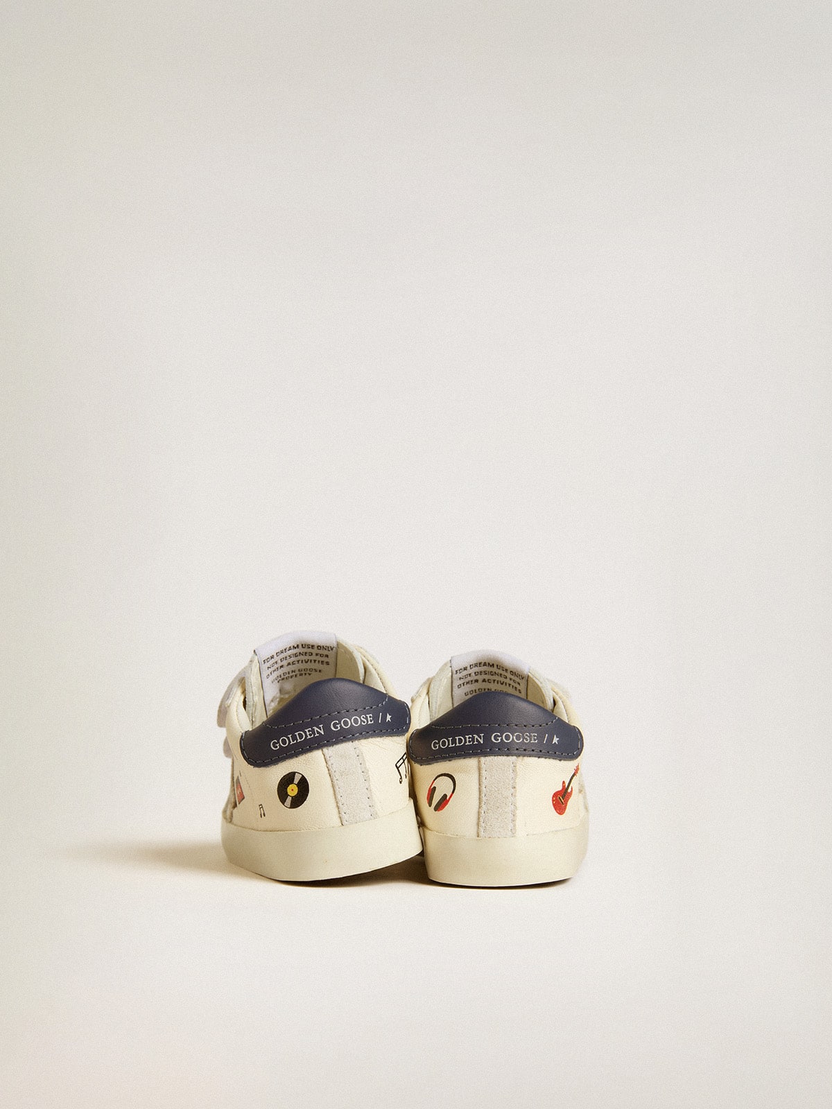 Baby School in nappa leather with musical print and white suede star