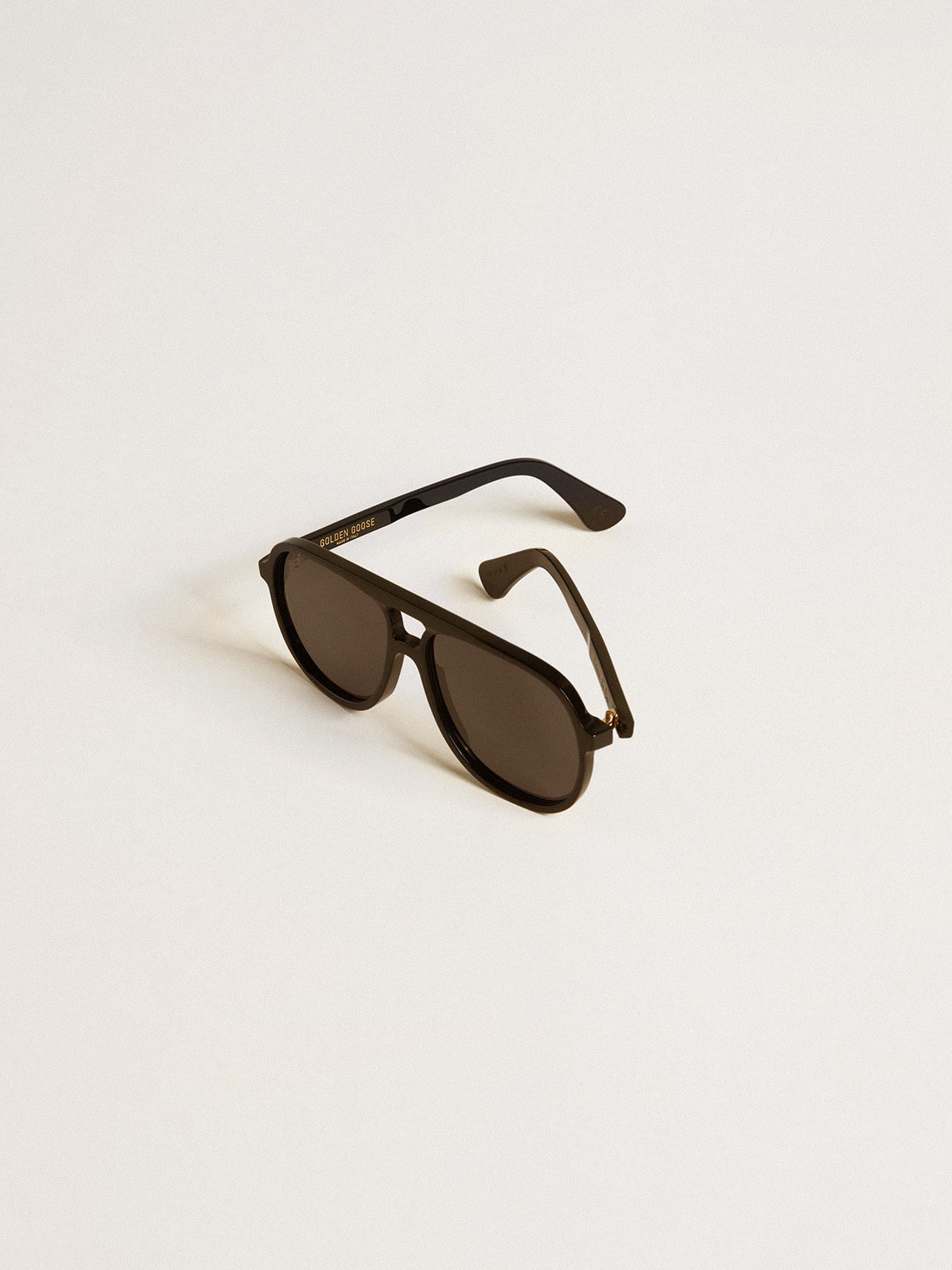 Aviator style sunglasses with black frame and lenses| Golden Goose